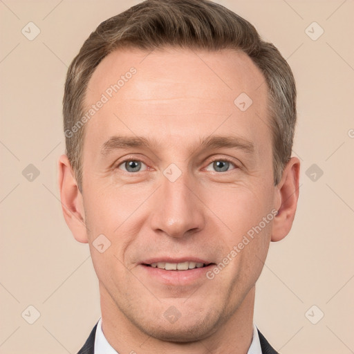 Joyful white adult male with short  brown hair and grey eyes