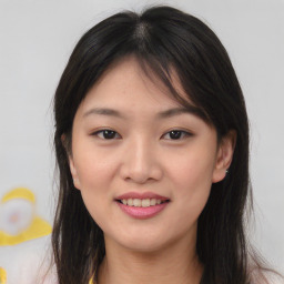 Joyful asian young-adult female with medium  brown hair and brown eyes