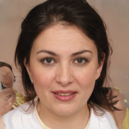 Joyful white young-adult female with medium  brown hair and brown eyes