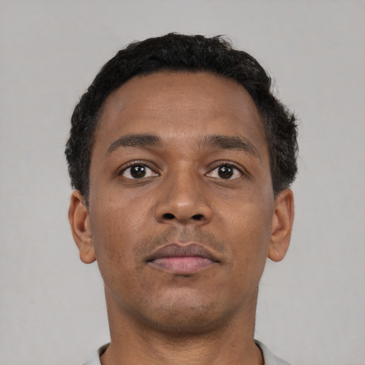 Neutral black young-adult male with short  brown hair and brown eyes