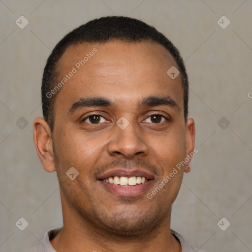 Joyful latino young-adult male with short  brown hair and brown eyes