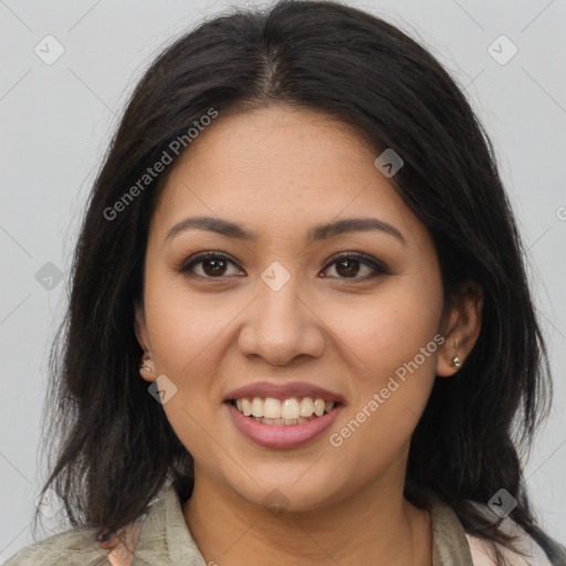 Joyful latino young-adult female with medium  brown hair and brown eyes