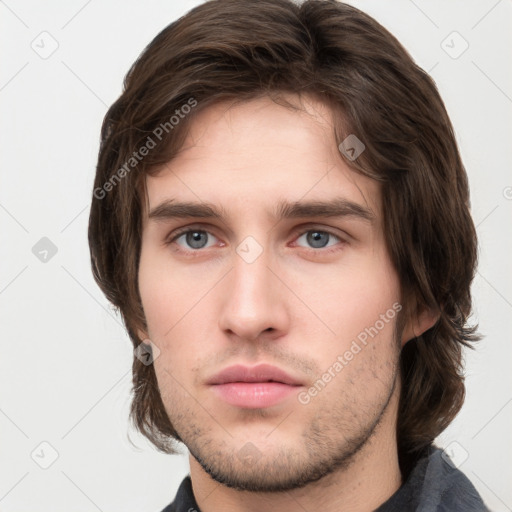 Neutral white young-adult male with short  brown hair and grey eyes