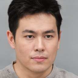 Neutral asian young-adult male with short  brown hair and brown eyes