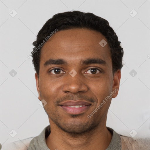Joyful black young-adult male with short  black hair and brown eyes