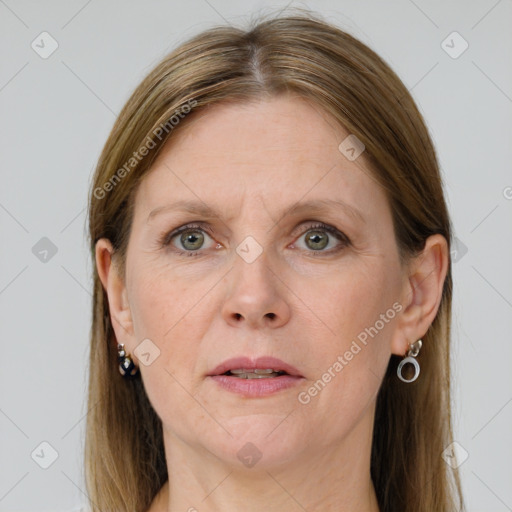 Joyful white adult female with long  brown hair and grey eyes