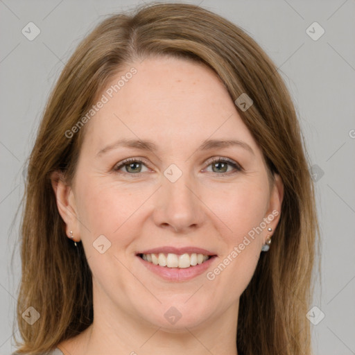 Joyful white adult female with long  brown hair and grey eyes