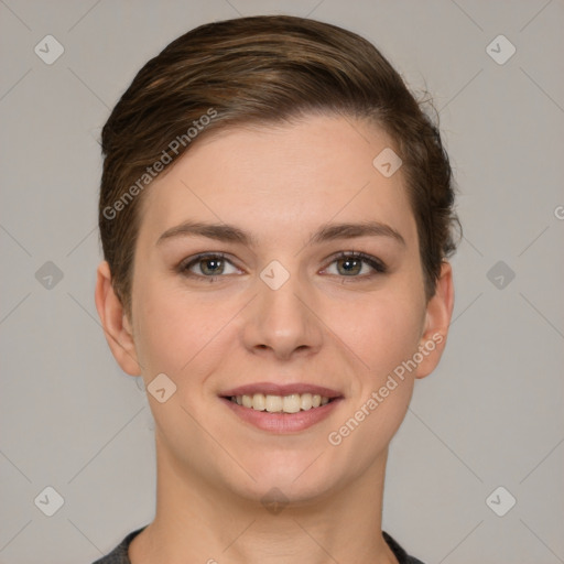 Joyful white young-adult female with short  brown hair and grey eyes