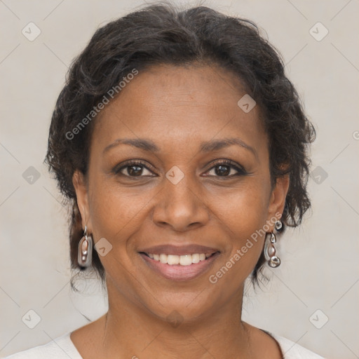 Joyful black adult female with short  brown hair and brown eyes