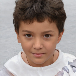 Joyful white child male with short  brown hair and brown eyes