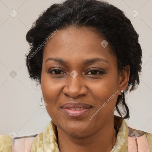 Joyful black adult female with medium  brown hair and brown eyes