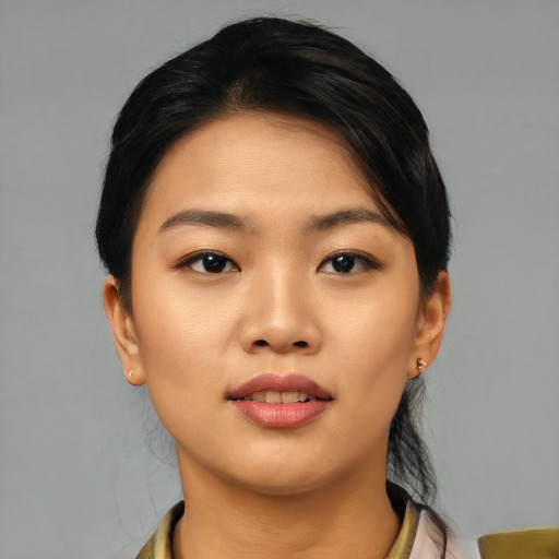Joyful asian young-adult female with medium  black hair and brown eyes