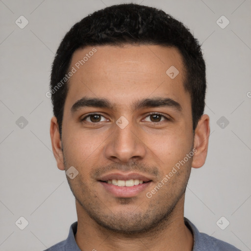 Joyful white young-adult male with short  black hair and brown eyes