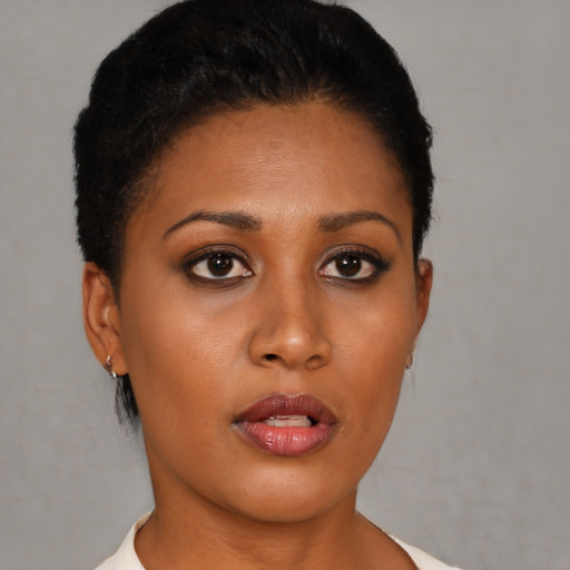 Neutral black young-adult female with short  brown hair and brown eyes
