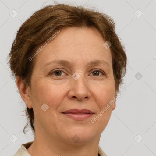 Joyful white adult female with short  brown hair and grey eyes