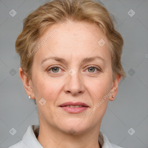 Joyful white adult female with short  brown hair and grey eyes