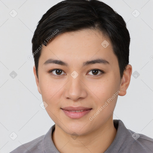 Joyful asian young-adult female with short  black hair and brown eyes