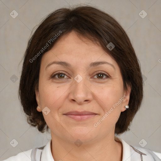 Joyful white adult female with medium  brown hair and brown eyes