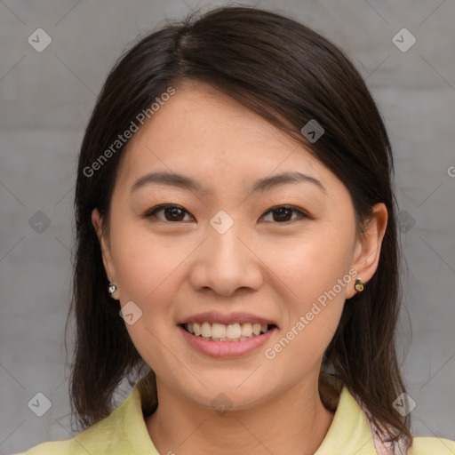 Joyful asian young-adult female with medium  brown hair and brown eyes