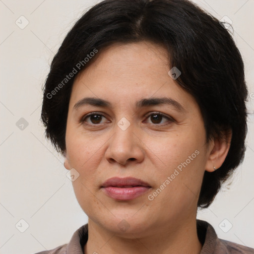 Joyful white adult female with medium  brown hair and brown eyes