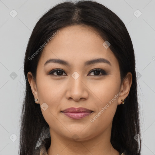 Joyful asian young-adult female with long  brown hair and brown eyes