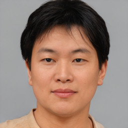 Neutral asian young-adult male with short  brown hair and brown eyes