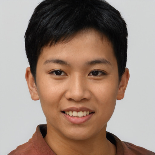 Joyful asian young-adult female with short  brown hair and brown eyes