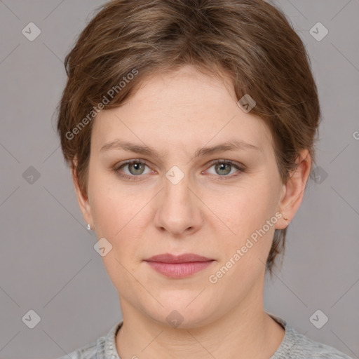 Joyful white young-adult female with short  brown hair and grey eyes