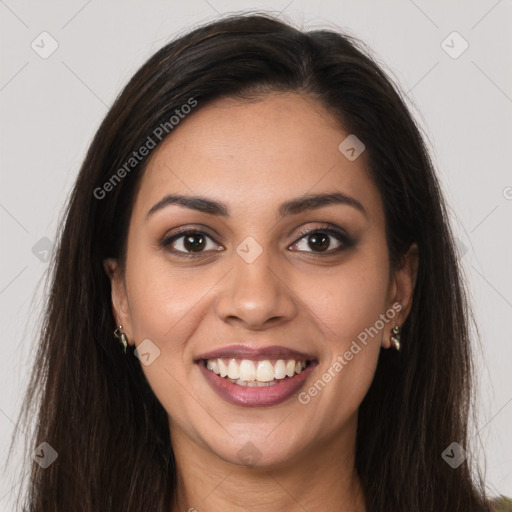 Joyful latino young-adult female with long  brown hair and brown eyes