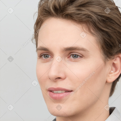 Joyful white young-adult female with short  brown hair and grey eyes