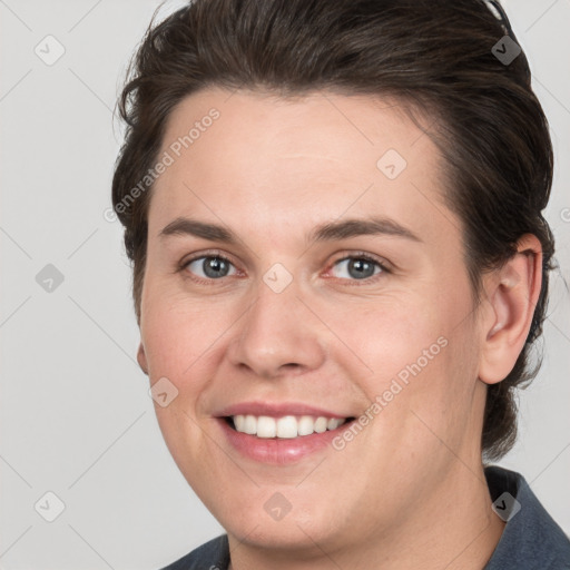 Joyful white young-adult female with medium  brown hair and grey eyes