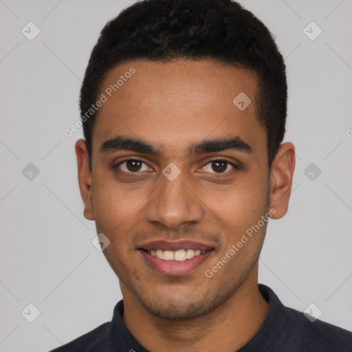 Joyful black young-adult male with short  black hair and brown eyes