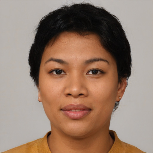 Joyful asian young-adult female with short  black hair and brown eyes