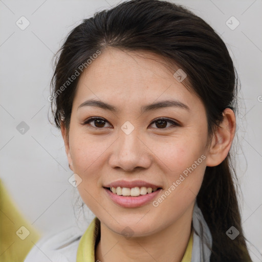 Joyful white young-adult female with medium  brown hair and brown eyes