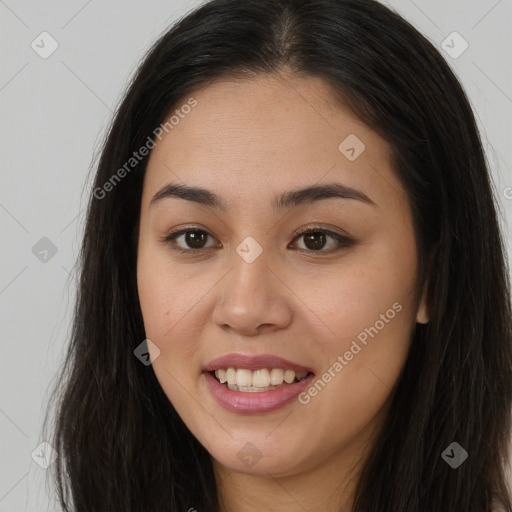 Joyful asian young-adult female with long  brown hair and brown eyes