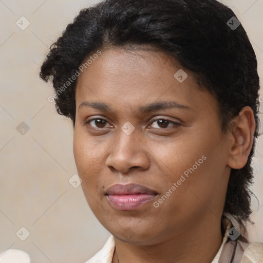 Joyful black young-adult female with short  brown hair and brown eyes