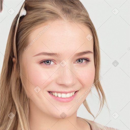 Joyful white young-adult female with long  brown hair and blue eyes