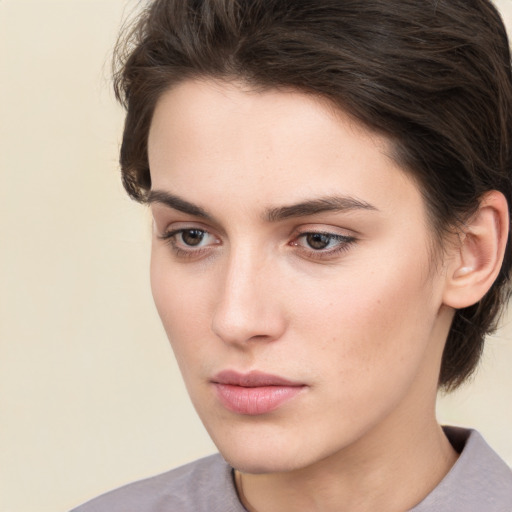 Neutral white young-adult female with medium  brown hair and brown eyes