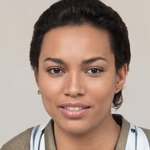 Joyful white young-adult female with short  black hair and brown eyes