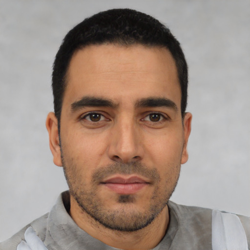Neutral latino young-adult male with short  black hair and brown eyes