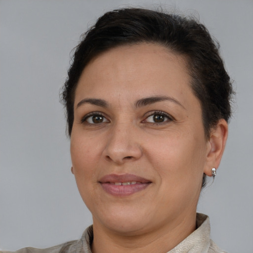Joyful white adult female with short  brown hair and brown eyes