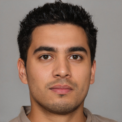 Neutral latino young-adult male with short  brown hair and brown eyes
