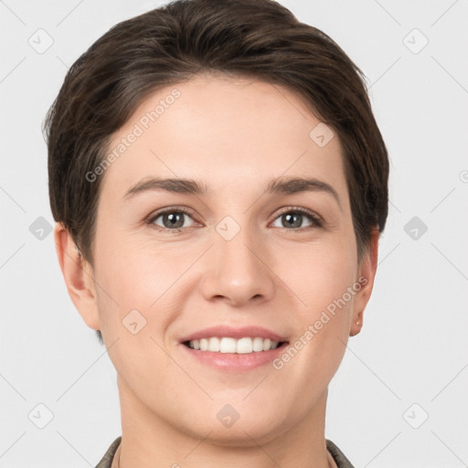 Joyful white young-adult female with short  brown hair and brown eyes