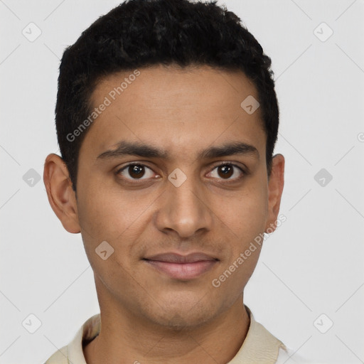 Joyful latino young-adult male with short  black hair and brown eyes