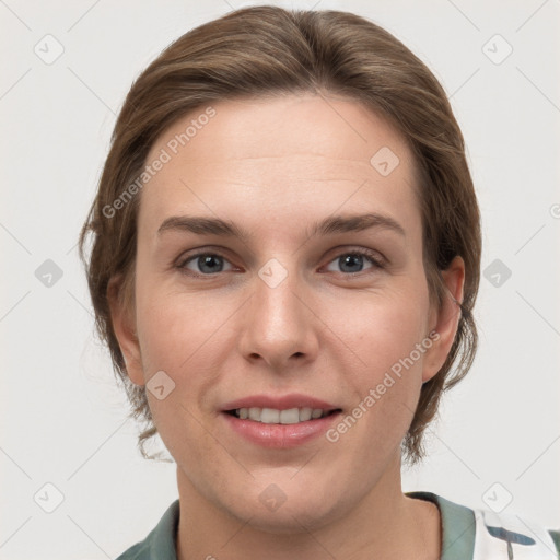 Joyful white young-adult female with medium  brown hair and grey eyes