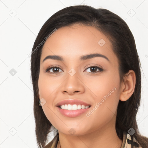 Joyful latino young-adult female with long  brown hair and brown eyes