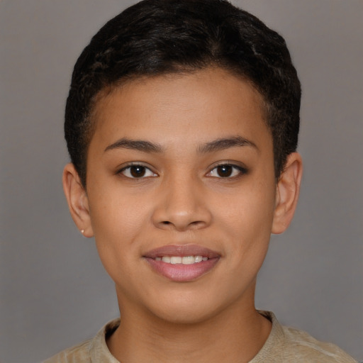 Joyful latino young-adult female with short  brown hair and brown eyes