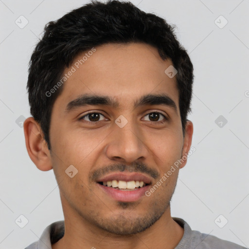 Joyful latino young-adult male with short  black hair and brown eyes