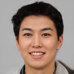 Joyful asian young-adult male with short  black hair and brown eyes