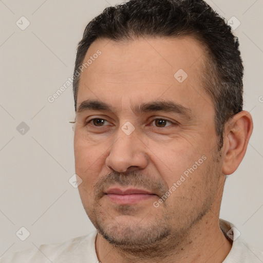 Joyful white adult male with short  brown hair and brown eyes